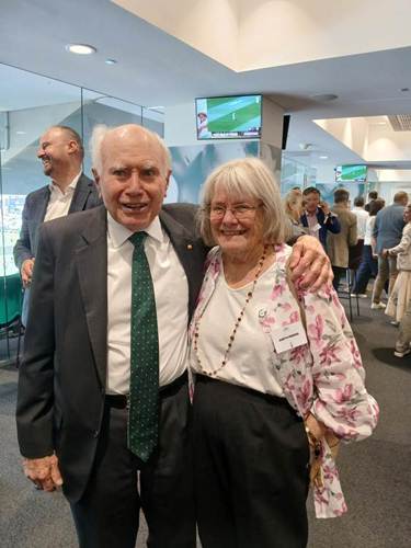 A person and person posing for a picture

AI-generated content may be incorrect.